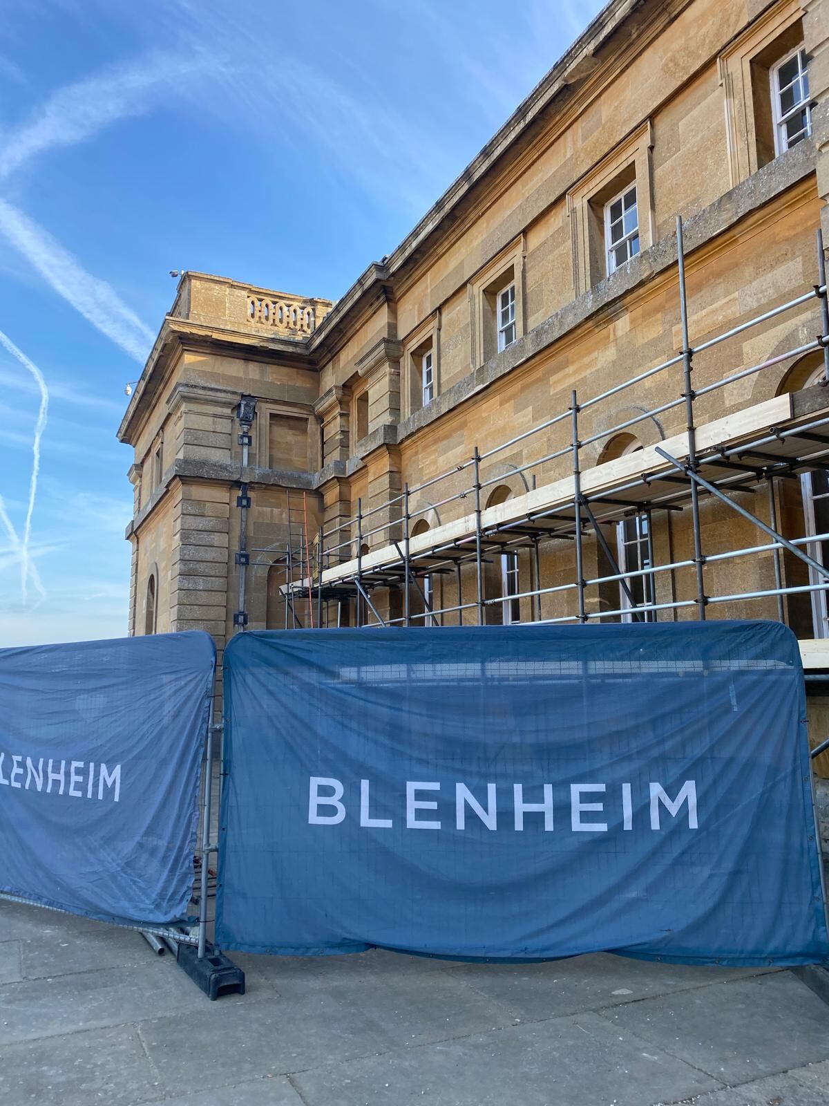 Scaffolding and Blenheim Palace branded hoarding during external decoration works by Brierty Decoration