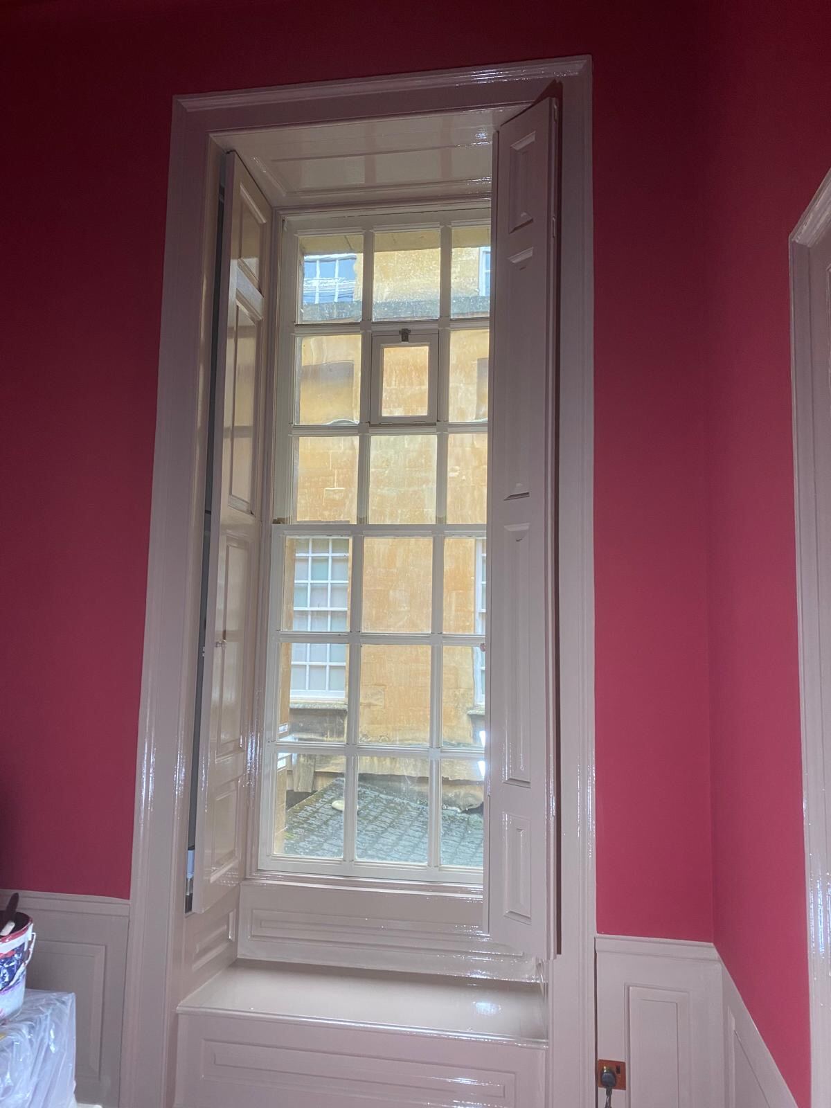 Finished sash window and shutters in heritage red state room at Blenheim Palace by Brierty Decoration
