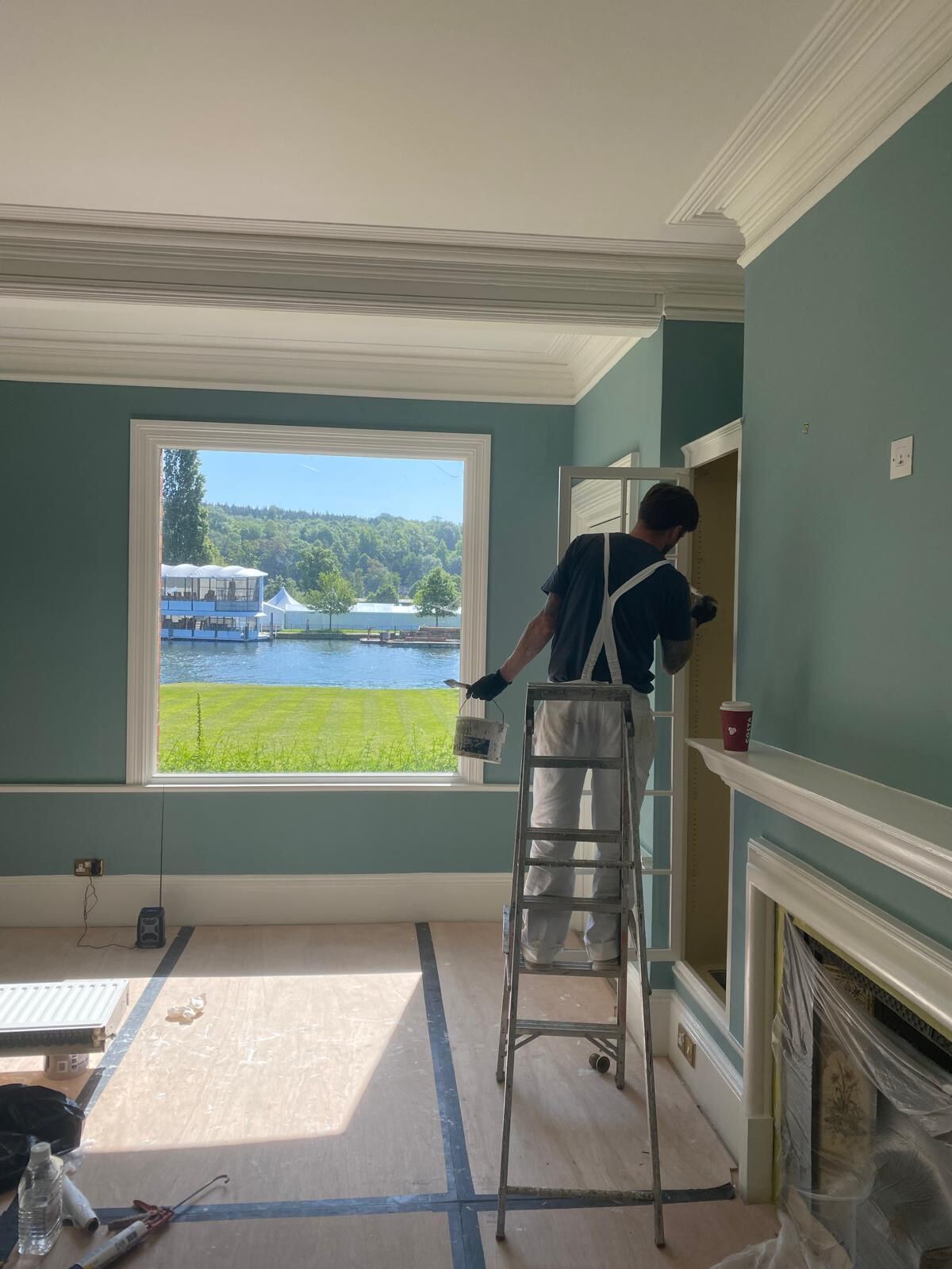 Brierty decorator at work in a riverside Henley-on-Thames property, with River Thames view